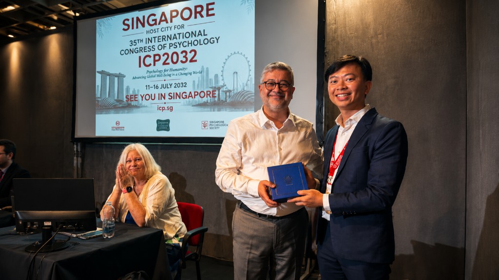 ICP 2032 host city certificate presentation on stage in Florence — Singapore entrusted to host